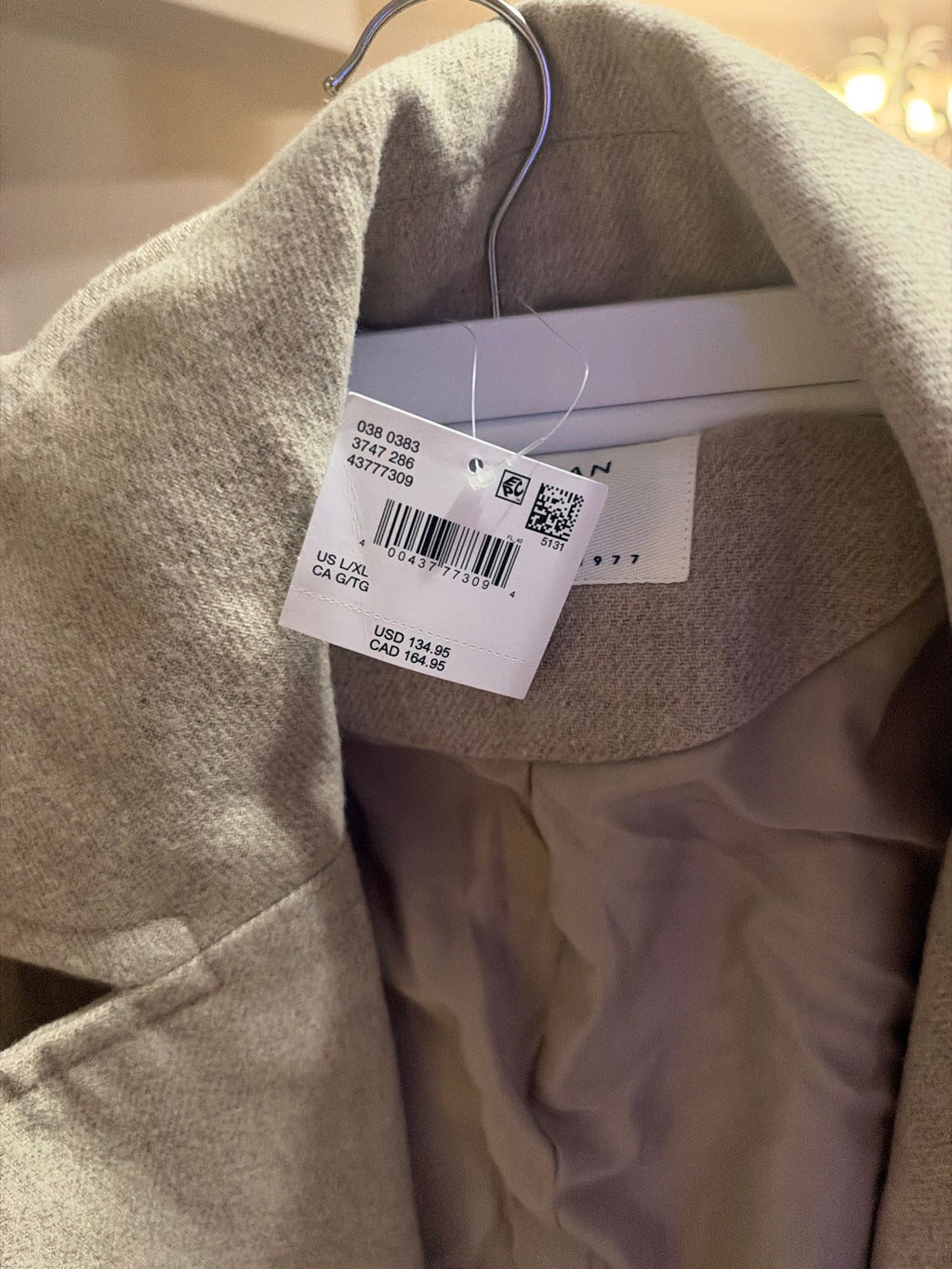Original tags attached showing size L/XL